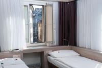 Hotel Alexander Zurich Old Townにあるベッド