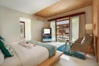 Theanna Villa and Spa Cangguにあるベッド