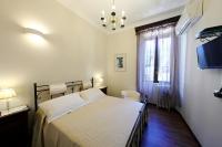 A bed or beds in a room at Villa Siciliana