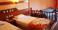 Postel nebo postele na pokoji v ubytování Amos Hotel