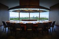 a large table in a room with a large window at Hotel New Otani Osaka in Osaka