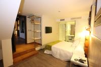 Postel nebo postele na pokoji v ubytování Evenia Alcalá Boutique Hotel