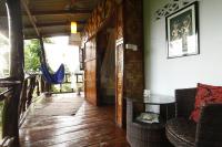 a hallway of a house with a table and chairs at Oon Lee Bungalows in Ko Jum