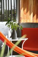 a plant in a vase on a table at Oon Lee Bungalows in Ko Jum