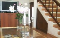 Telewizja i/lub zestaw kina domowego w obiekcie Absolute Beachfront House II