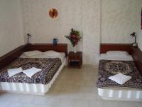 A bed or beds in a room at Summer Lodge