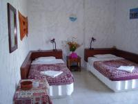 A bed or beds in a room at Summer Lodge