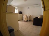 Televízia a/alebo spoločenská miestnosť v ubytovaní Apartment Donat