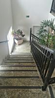 a set of stairs with a pot of plants at Hotel Vila do Conde in Itu