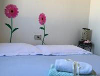 Posteľ alebo postele v izbe v ubytovaní A casa di Nonna Maria