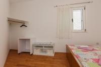 Postel nebo postele na pokoji v ubytování Apartments Rogulj
