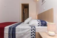 Postel nebo postele na pokoji v ubytování Apartments Nikolina