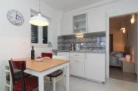 Kuchyň nebo kuchyňský kout v ubytování Apartments Nikolina