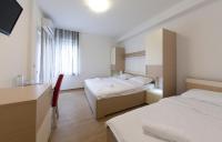 Postel nebo postele na pokoji v ubytování Guesthouse Villa Klara