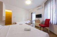 Postel nebo postele na pokoji v ubytování Guesthouse Villa Klara