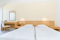 Posteľ alebo postele v izbe v ubytovaní Hotel Riviera