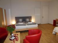 Postel nebo postele na pokoji v ubytování Hôtel Garni Villa Carmen