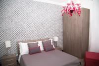 Posteľ alebo postele v izbe v ubytovaní Nobilcasa Suites