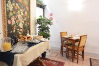 a dining room with a table with food on it at Hotel San Zulian in Venice