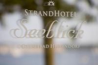 a sign that says grand hotel deetridge on a window at StrandHotel Seeblick, Ostseebad Heikendorf in Heikendorf