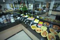 a buffet line with many different types of food at Skala Traveling Hotel in Cuiabá