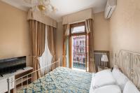 a hotel room with a bed and a window at Hotel Montecarlo in Venice
