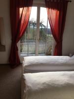 Postel nebo postele na pokoji v ubytování B&B Pension Marina