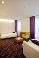 Posteľ alebo postele v izbe v ubytovaní Hotel Sport
