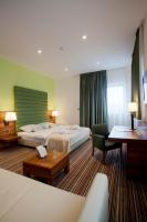 Posteľ alebo postele v izbe v ubytovaní Hotel Sport