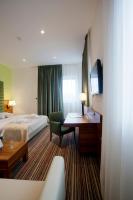 Posteľ alebo postele v izbe v ubytovaní Hotel Sport