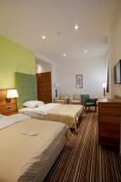 Posteľ alebo postele v izbe v ubytovaní Hotel Sport