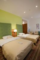 Posteľ alebo postele v izbe v ubytovaní Hotel Sport