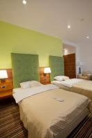 Posteľ alebo postele v izbe v ubytovaní Hotel Sport