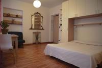 A bed or beds in a room at La Giara del Centro