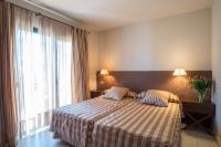 Postel nebo postele na pokoji v ubytování Apartaments Suites Sant Jordi