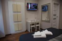 Televízia a/alebo spoločenská miestnosť v ubytovaní Maison Imperiale