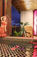 a statue on a porch with a checkered floor at Beautiful Yilan Resort in Dongshan