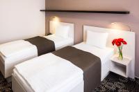 Łóżko lub łóżka w pokoju w obiekcie Parkhotel Plzen Congress Center