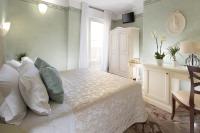 Posteľ alebo postele v izbe v ubytovaní Hotel Apollo