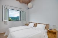 Posteľ alebo postele v izbe v ubytovaní Schiza Houses