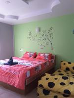 Postel nebo postele na pokoji v ubytování สิชล บ้านอุ๊ รีสอร์ท