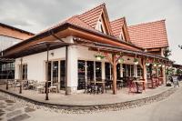 a restaurant with tables and chairs on a patio at Pension Zwicker in Prešov