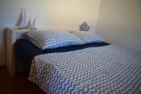 A bed or beds in a room at Casa Bedda