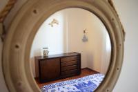 A bed or beds in a room at Casa Bedda