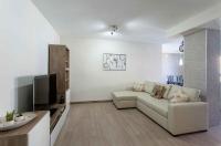 Televízia a/alebo spoločenská miestnosť v ubytovaní Apartment Malvarrosa Beach Cavite