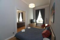 Supreme City Center Apartmentにあるベッド