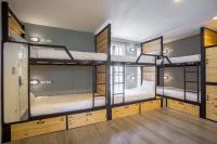 Postel nebo postele na pokoji v ubytování X9Hostel