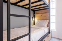Postel nebo postele na pokoji v ubytování X9Hostel