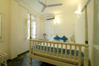 Een bed of bedden in een kamer bij Fort Heaven - Galle Fort