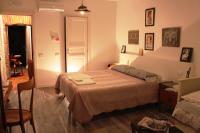 Postel nebo postele na pokoji v ubytování Le Dame Della Cortesella B&B